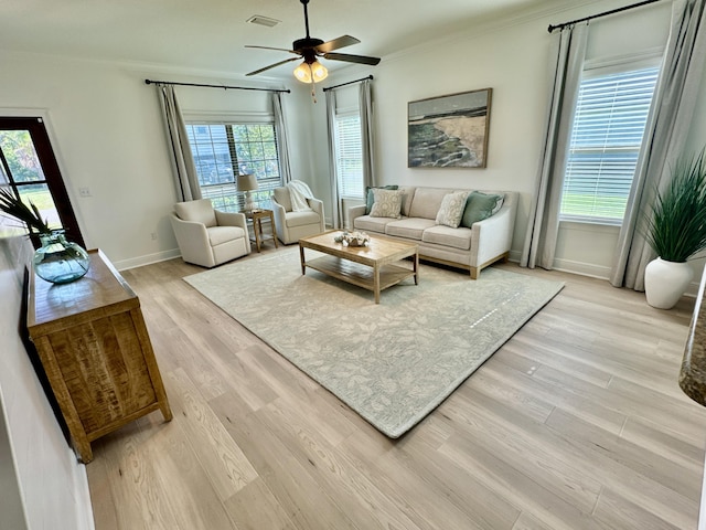 258 Tropical Breeze Dr, Santa Rosa Beach, FL 32459 - living area featuring a ceiling fan, light wood finished floors, and crown molding