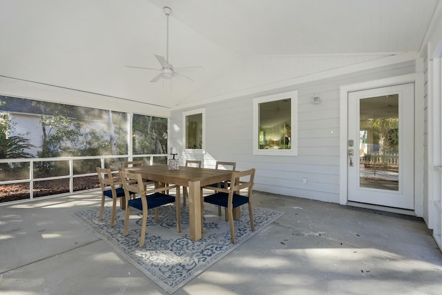 sunroom featuring lofted ceiling and ceiling fan