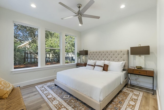 bedroom featuring hardwood / wood-style flooring and ceiling fan