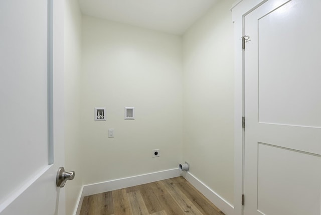 laundry room with electric dryer hookup, light hardwood / wood-style flooring, and washer hookup