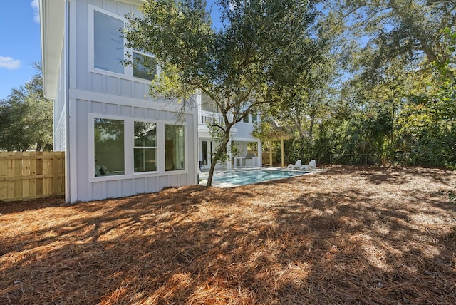 exterior space with a fenced in pool