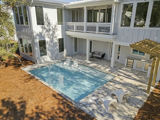 back of house with a patio area and a pergola