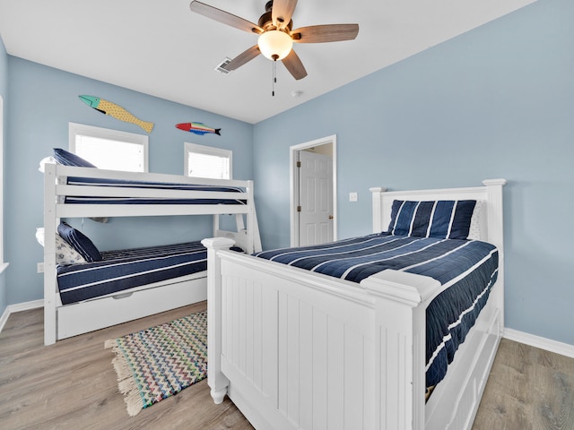 bedroom featuring light hardwood / wood-style flooring and ceiling fan