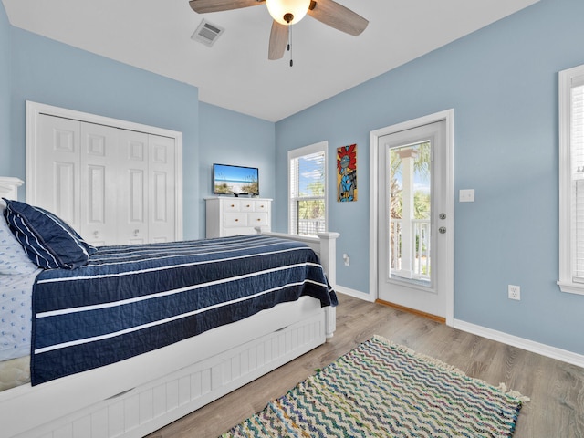 bedroom with wood-type flooring, a closet, and ceiling fan