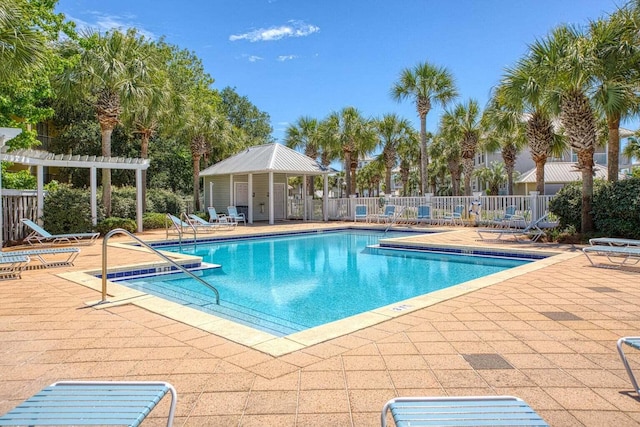 view of swimming pool with a patio area