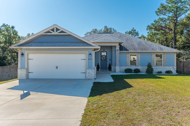 view of front of house with a front lawn and a garage