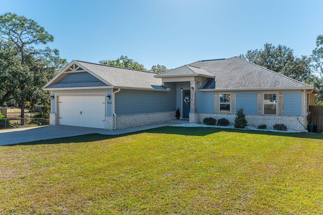 view of front of home featuring a garage and a front lawn