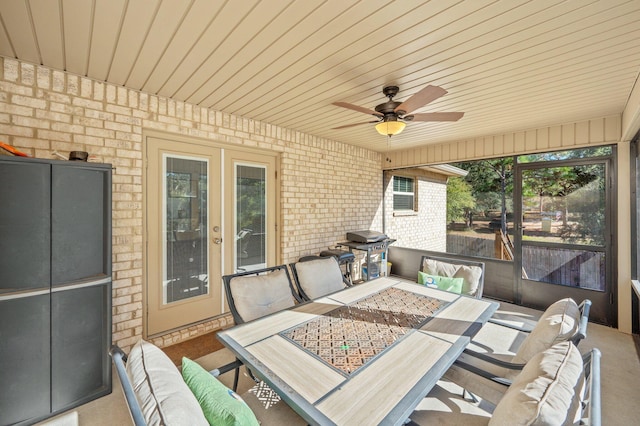 view of patio with ceiling fan and a grill