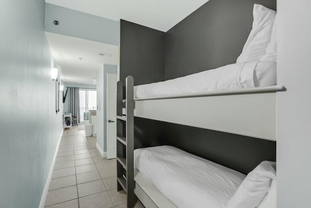 bedroom with light tile patterned floors