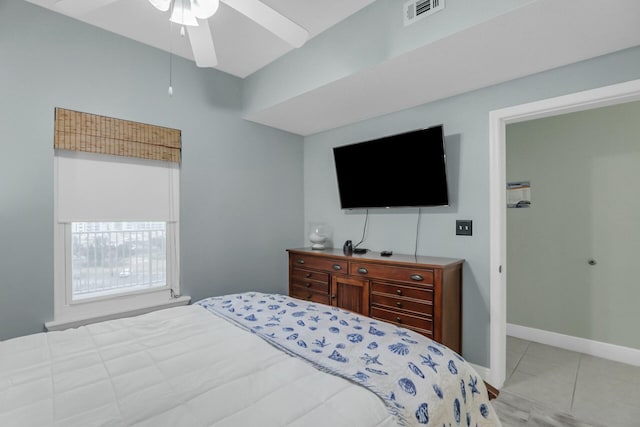 bedroom featuring ceiling fan and light tile patterned floors