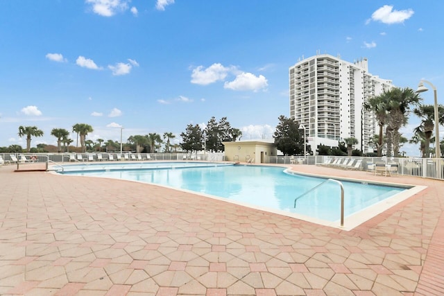 view of swimming pool featuring a patio area