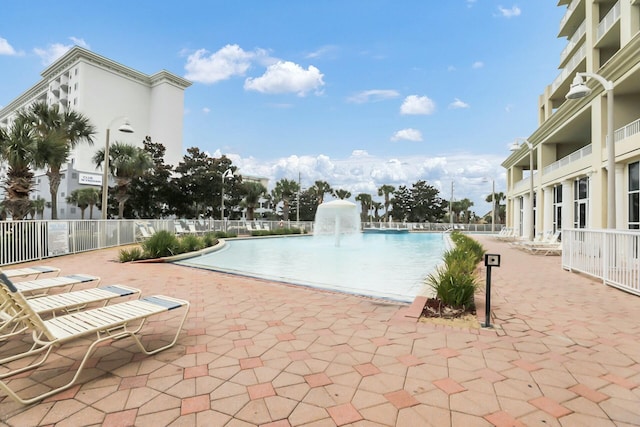 view of swimming pool featuring pool water feature