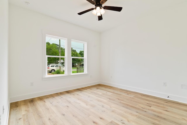 unfurnished room with ceiling fan, light wood-type flooring, and baseboards