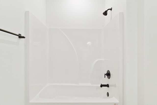 bathroom with bathing tub / shower combination