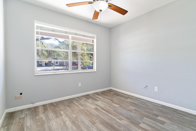 unfurnished room featuring ceiling fan and light hardwood / wood-style floors