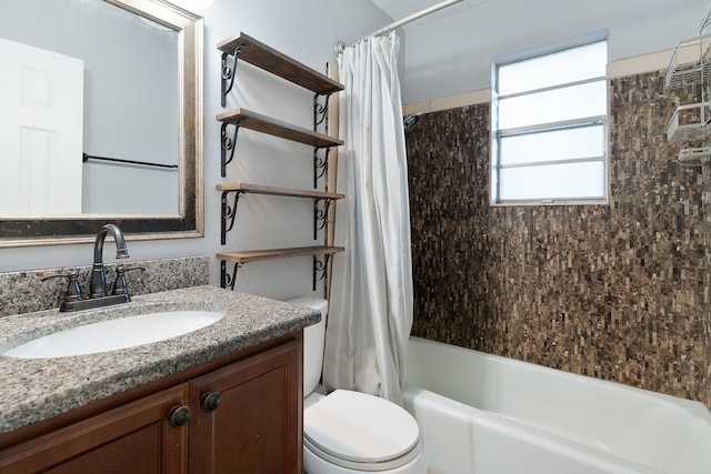 full bathroom with vanity, toilet, and shower / bathtub combination with curtain