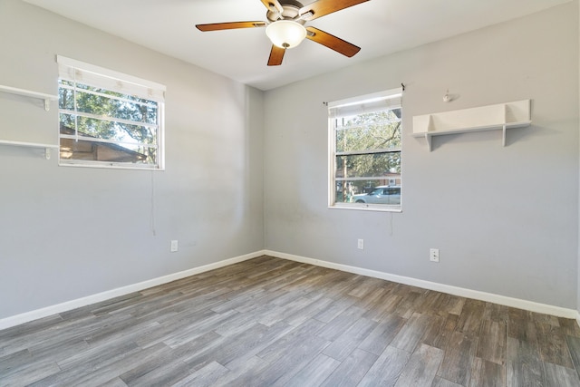 spare room with wood-type flooring and ceiling fan