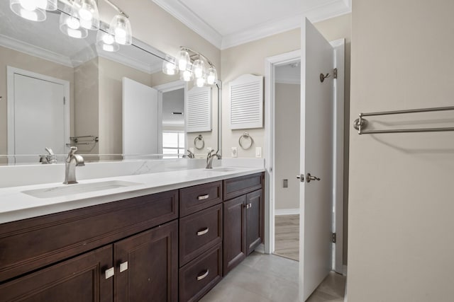 bathroom featuring tile patterned flooring, vanity, and ornamental molding