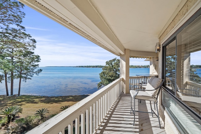 balcony featuring a water view