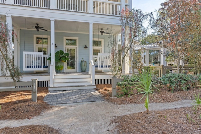 entrance to property featuring ceiling fan