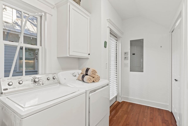 washroom with cabinets, electric panel, dark hardwood / wood-style floors, and washing machine and clothes dryer