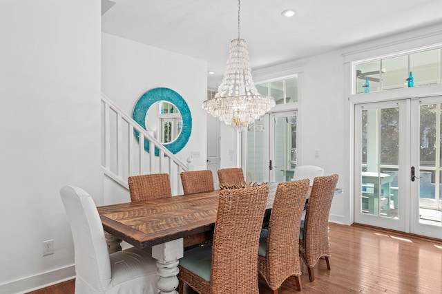 dining room featuring a chandelier, french doors, and wood-type flooring