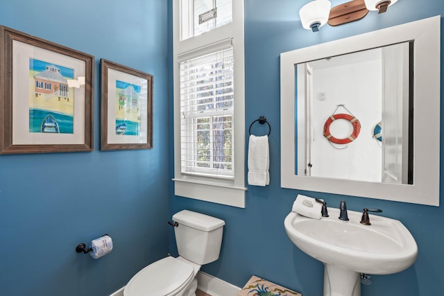 bathroom featuring sink and toilet