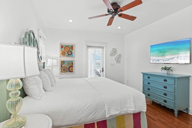 bedroom featuring ceiling fan and dark hardwood / wood-style floors