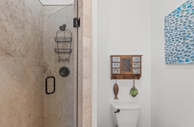 bathroom featuring toilet and walk in shower