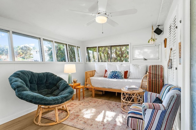 sunroom / solarium featuring ceiling fan and lofted ceiling