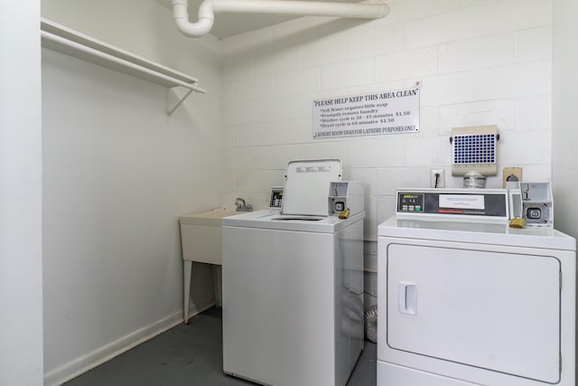 laundry room with washing machine and dryer