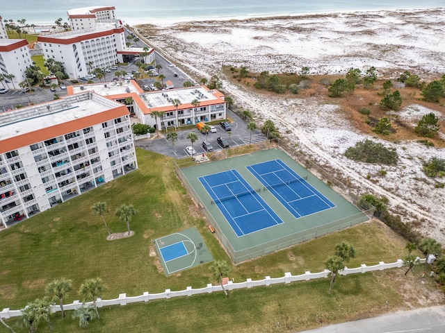 bird's eye view with a water view and a beach view