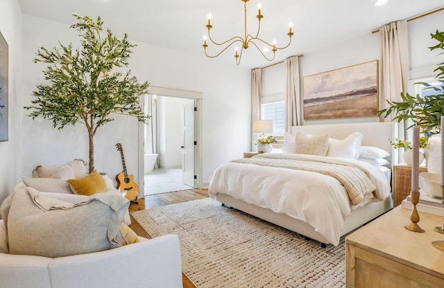 bedroom featuring a chandelier and light hardwood / wood-style floors