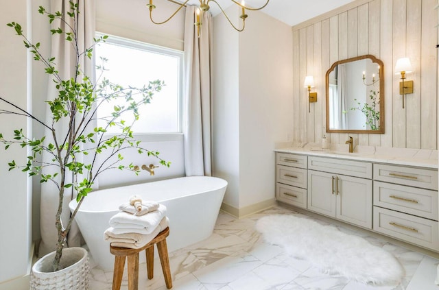 bathroom featuring a washtub, vanity, and wooden walls