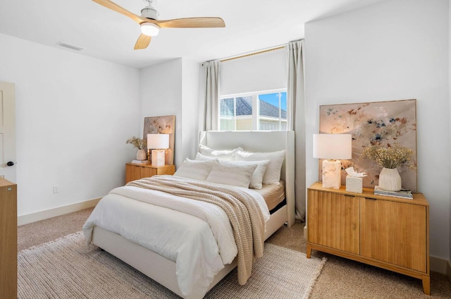 bedroom featuring light carpet and ceiling fan