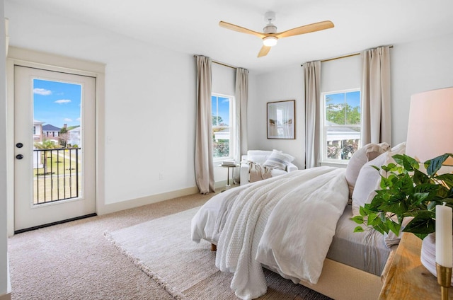 bedroom with access to exterior, ceiling fan, and light colored carpet