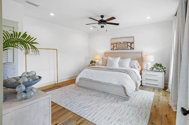 bedroom featuring light wood-type flooring and ceiling fan