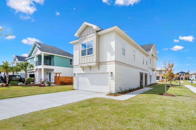 view of side of home featuring a garage, a yard, and a balcony