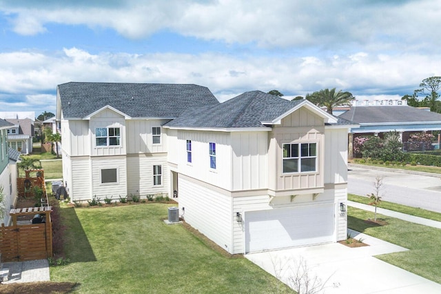 view of front of property with central AC, a front lawn, and a garage