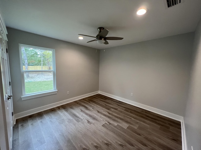 unfurnished room with wood-type flooring and ceiling fan