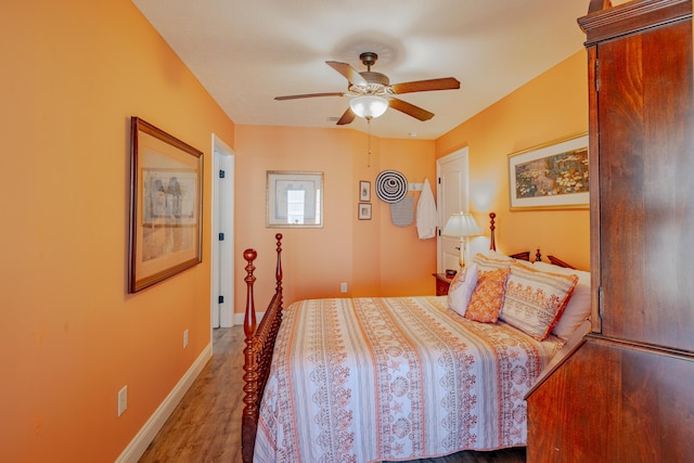 bedroom featuring hardwood / wood-style flooring and ceiling fan