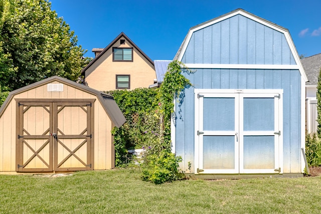 view of outbuilding featuring a lawn