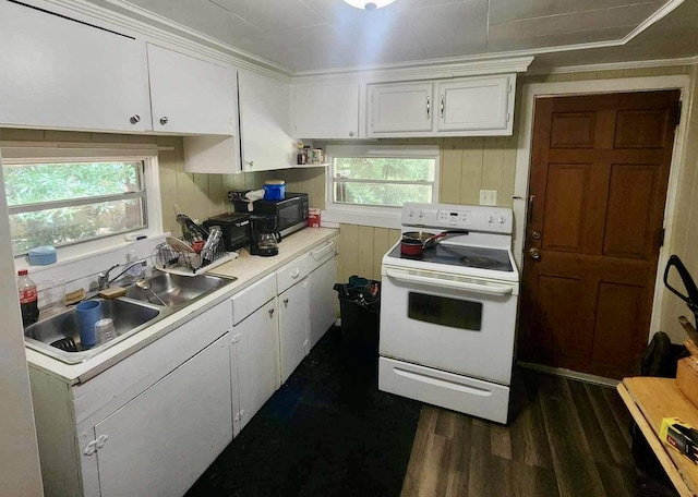 kitchen with white cabinets, white range with electric stovetop, plenty of natural light, and sink