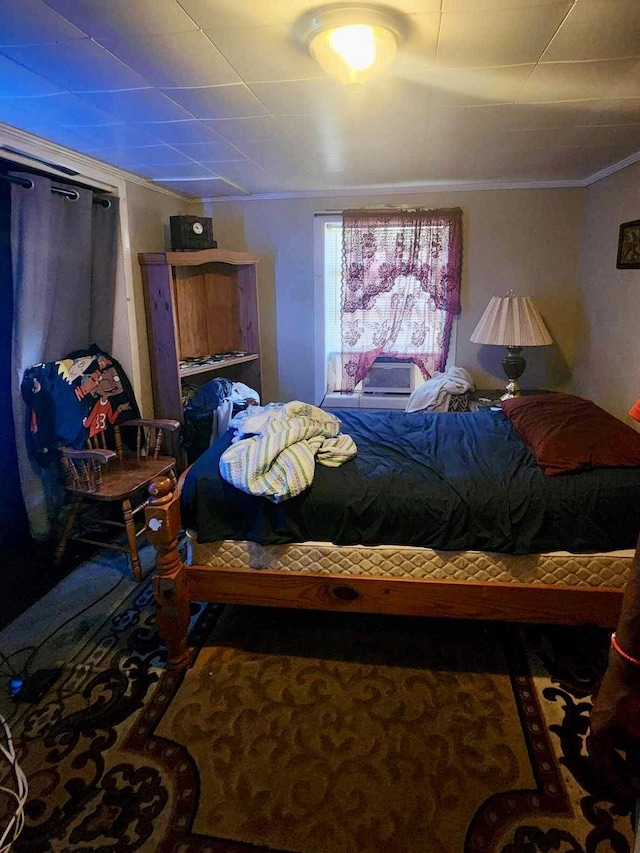 bedroom featuring crown molding