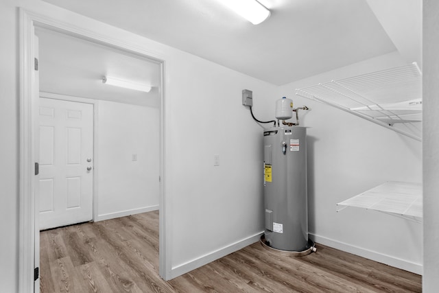 utility room featuring electric water heater