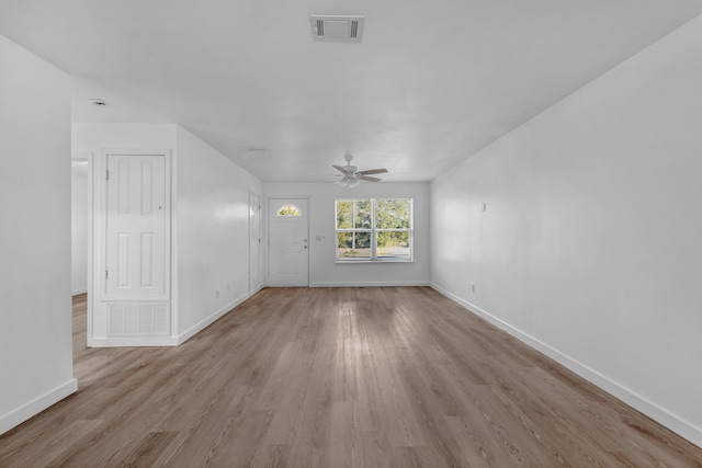 unfurnished living room featuring light wood-type flooring and ceiling fan