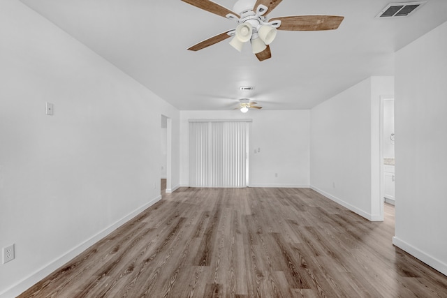 unfurnished living room with ceiling fan and light hardwood / wood-style floors