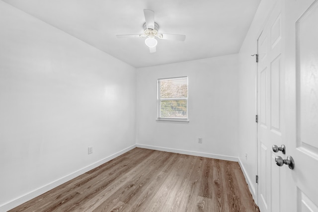 empty room with ceiling fan and light wood-type flooring