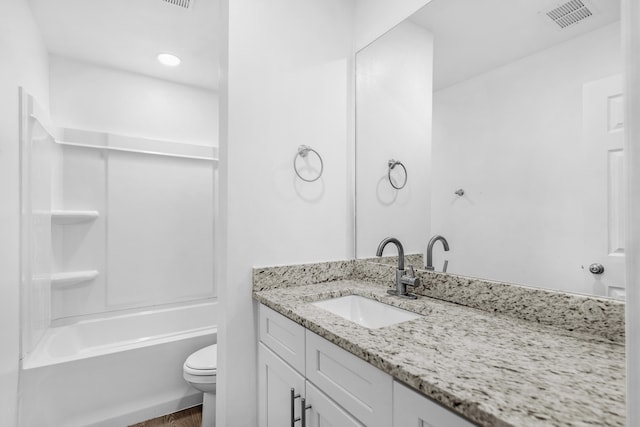 full bathroom with vanity, toilet, and washtub / shower combination