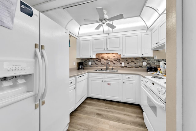 kitchen with white cabinetry, sink, tasteful backsplash, light hardwood / wood-style floors, and white appliances